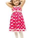 Portrait of a pretty little girl in pink dress on white background